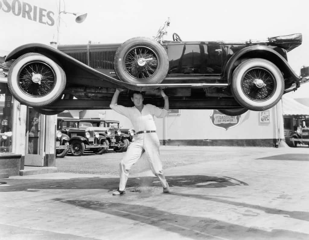 Man lifting car
